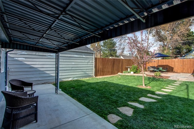 view of yard featuring a patio and a fenced backyard