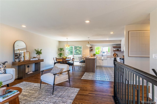 9410 Perry St, Westminster, CO 80031 - living area featuring dark wood-type flooring and recessed lighting