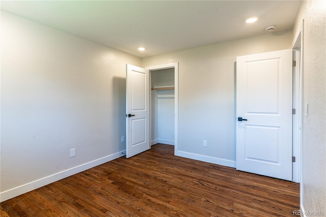 9410 Perry St, Westminster, CO 80031 - unfurnished bedroom featuring dark wood-type flooring, recessed lighting, and a closet