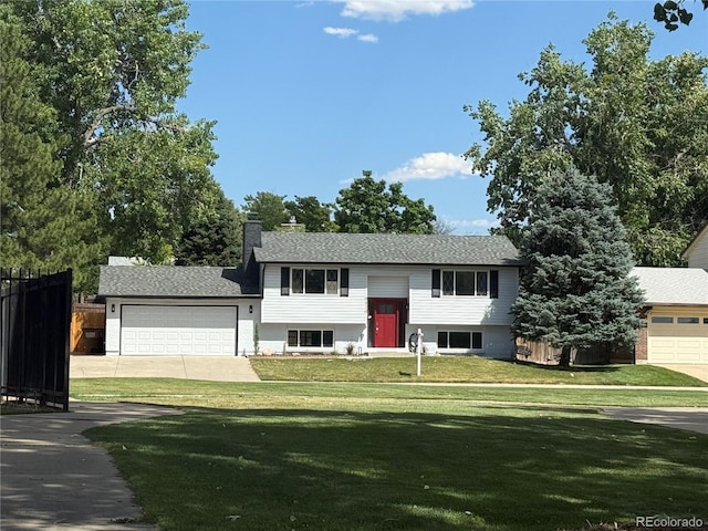 9410 Perry St, Westminster, CO 80031 - split foyer home with a garage and driveway