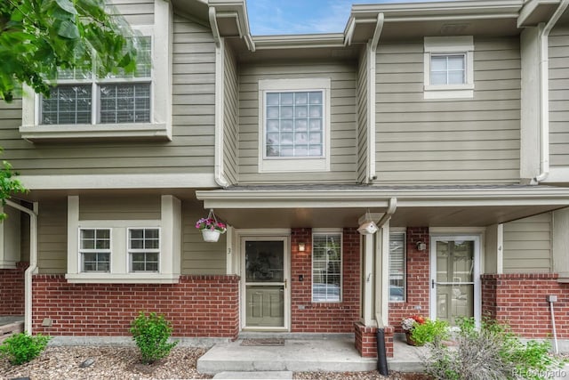9110 Gale Blvd Unit 3, Thornton, CO 80260 - property entrance featuring brick siding