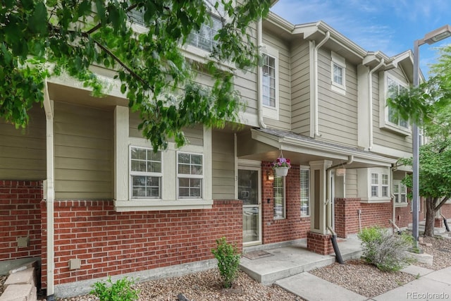9110 Gale Blvd Unit 3, Thornton, CO 80260 - townhome / multi-family property featuring brick siding and a porch