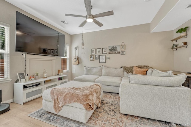 9110 Gale Blvd Unit 3, Thornton, CO 80260 - living room featuring a ceiling fan, light wood finished floors, and baseboards