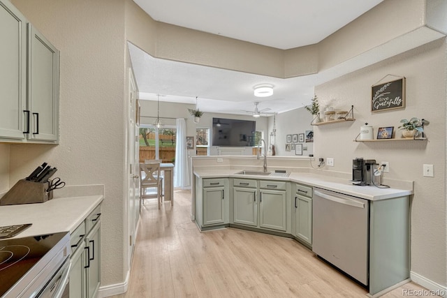 9110 Gale Blvd Unit 3, Thornton, CO 80260 - kitchen featuring stainless steel dishwasher, a peninsula, a sink, light wood-type flooring, and light countertops