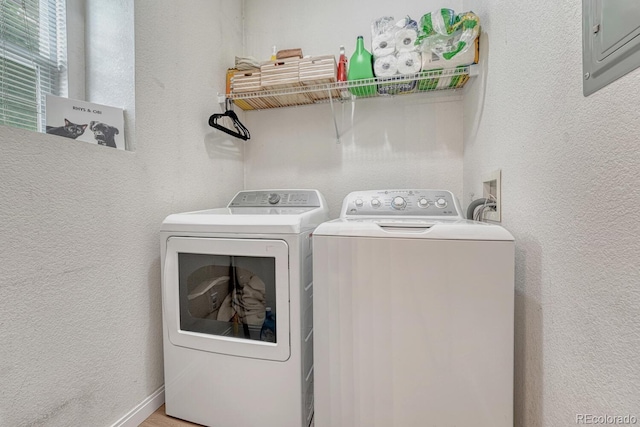 9110 Gale Blvd Unit 3, Thornton, CO 80260 - washroom featuring washer and clothes dryer, a textured wall, and electric panel