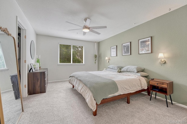 9110 Gale Blvd Unit 3, Thornton, CO 80260 - bedroom with light colored carpet, a ceiling fan, a textured ceiling, and baseboards