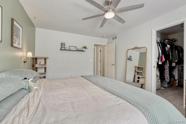 9110 Gale Blvd Unit 3, Thornton, CO 80260 - bedroom with a spacious closet, carpet floors, ceiling fan, and a closet