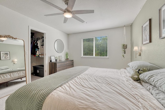 9110 Gale Blvd Unit 3, Thornton, CO 80260 - bedroom featuring a textured wall, carpet, ceiling fan, a spacious closet, and a textured ceiling