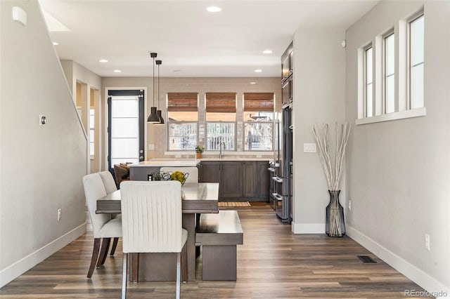 dining space featuring dark hardwood / wood-style flooring