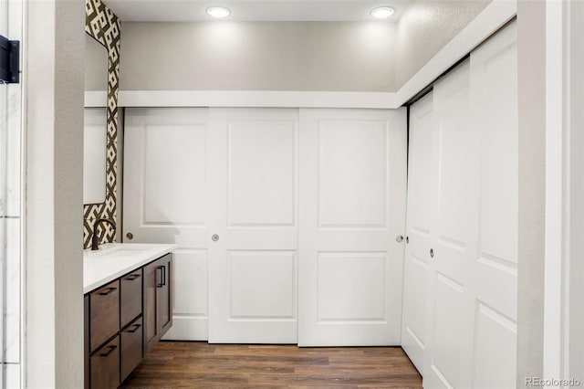 interior space featuring hardwood / wood-style flooring and vanity