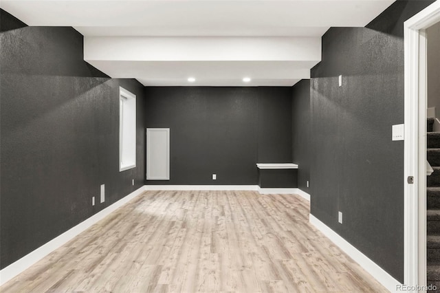 basement featuring light wood-type flooring