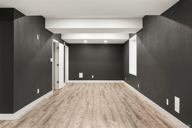 basement featuring light wood-type flooring