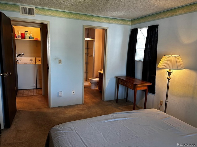 bedroom featuring carpet flooring, separate washer and dryer, ensuite bathroom, a textured ceiling, and a closet