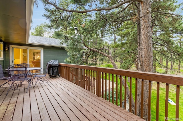14960 Spiritwood Loop, Elbert, CO 80106 - wooden deck featuring grilling area and outdoor dining area