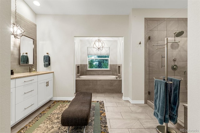14960 Spiritwood Loop, Elbert, CO 80106 - bathroom featuring vanity, a garden tub, and a shower stall