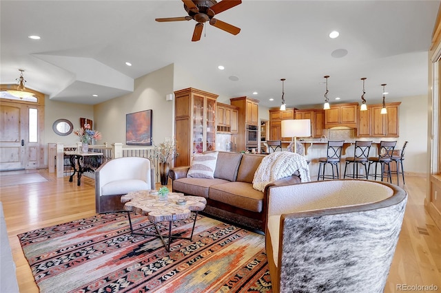 1007 Nob Hill Rd, Evergreen, CO 80439 - living area with light wood-style floors, a ceiling fan, vaulted ceiling, and recessed lighting