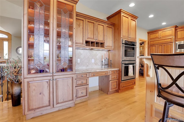 1007 Nob Hill Rd, Evergreen, CO 80439 - kitchen with appliances with stainless steel finishes, recessed lighting, light wood-style flooring, decorative backsplash, and open shelves