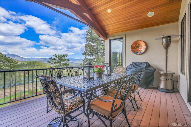 1007 Nob Hill Rd, Evergreen, CO 80439 - wooden deck featuring a mountain view and outdoor dining space