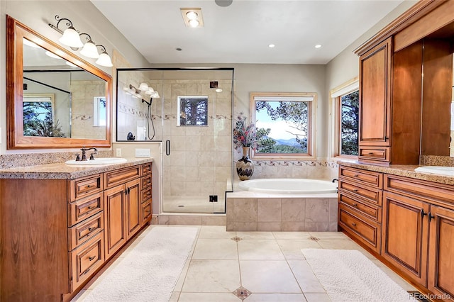 1007 Nob Hill Rd, Evergreen, CO 80439 - full bath with two vanities, tile patterned floors, a shower stall, and a garden tub