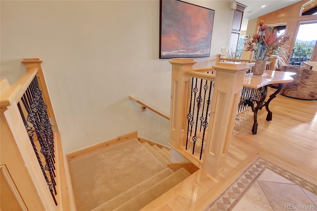 1007 Nob Hill Rd, Evergreen, CO 80439 - staircase with baseboards and wood finished floors