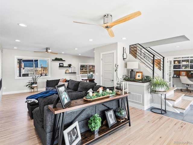 living room featuring recessed lighting, wood finished floors, visible vents, a ceiling fan, and stairway