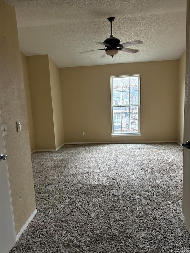 unfurnished room with carpet, a textured ceiling, and ceiling fan