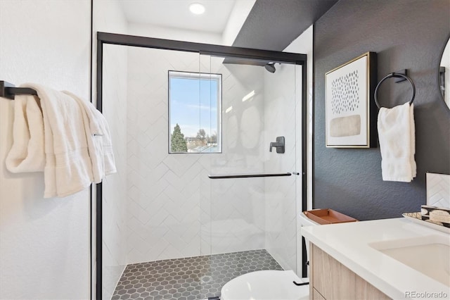 5128 W 26th Ave Unit 312, Denver, CO 80212 - bathroom featuring vanity, a stall shower, and a textured wall