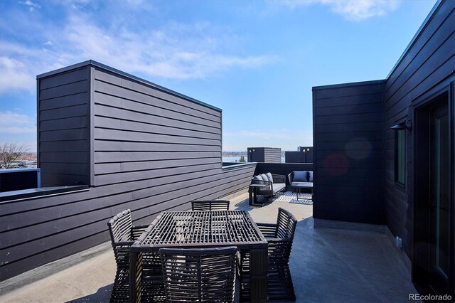 5128 W 26th Ave Unit 312, Denver, CO 80212 - view of patio featuring outdoor dining area