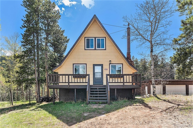 9185 Jill Dr, Conifer, CO 80433 - back of property with a wooden deck and a chimney