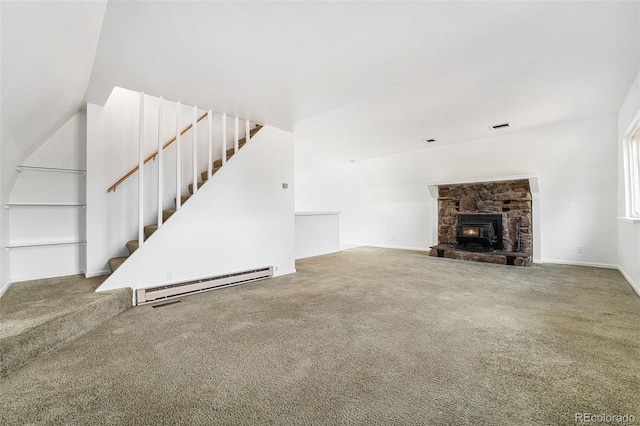 9185 Jill Dr, Conifer, CO 80433 - unfurnished living room featuring baseboard heating, carpet floors, stairway, and baseboards
