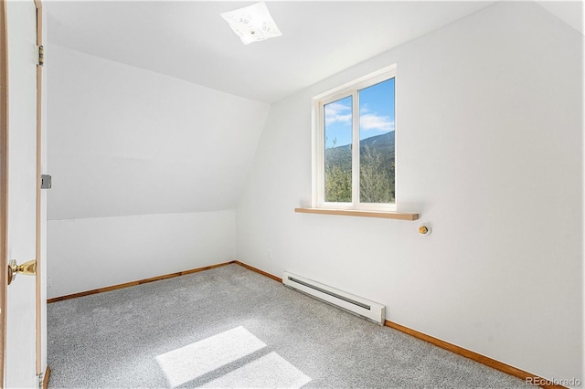 9185 Jill Dr, Conifer, CO 80433 - carpeted empty room with baseboard heating, vaulted ceiling, baseboards, and a mountain view