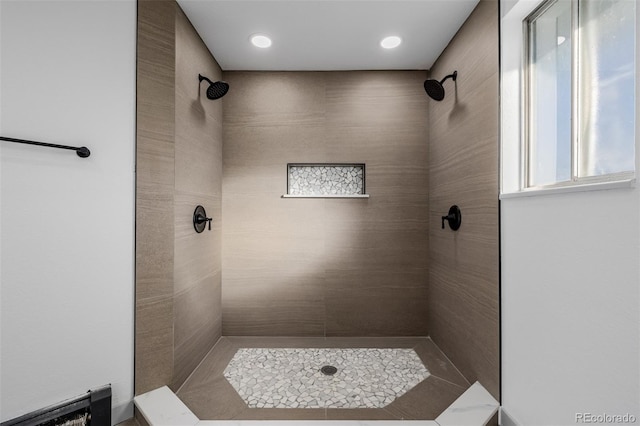 bathroom featuring a tile shower