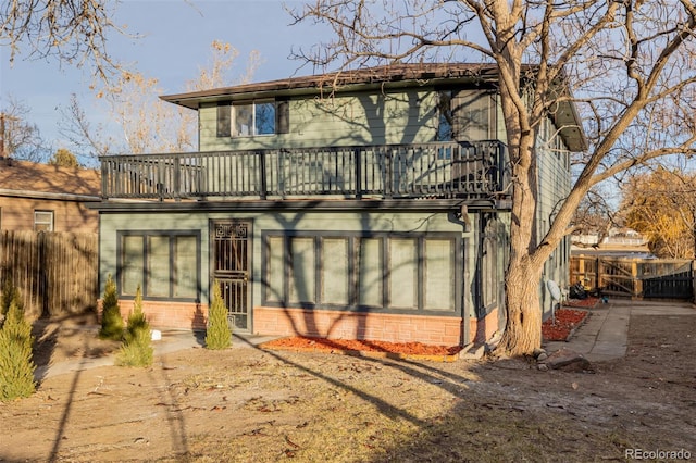 rear view of house with a balcony