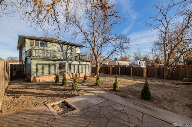 view of yard with a balcony