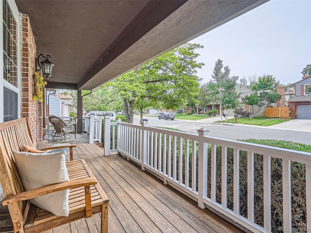3265 W 11th Avenue Ct, Broomfield, CO 80020 - wooden deck featuring a porch