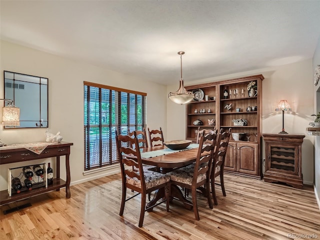 3265 W 11th Avenue Ct, Broomfield, CO 80020 - dining room featuring light wood finished floors and baseboards