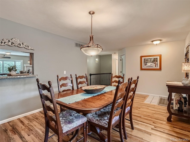 3265 W 11th Avenue Ct, Broomfield, CO 80020 - dining space with light wood-style flooring and baseboards
