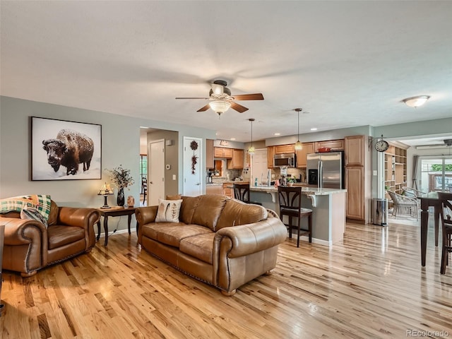 3265 W 11th Avenue Ct, Broomfield, CO 80020 - living room with a ceiling fan, light wood-type flooring, baseboards, and recessed lighting