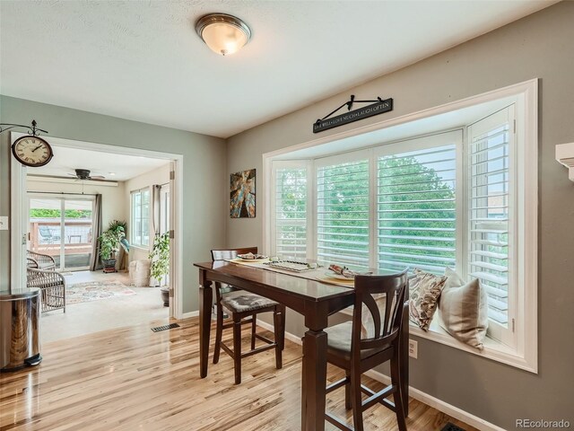 3265 W 11th Avenue Ct, Broomfield, CO 80020 - dining area with light wood finished floors, baseboards, and a ceiling fan