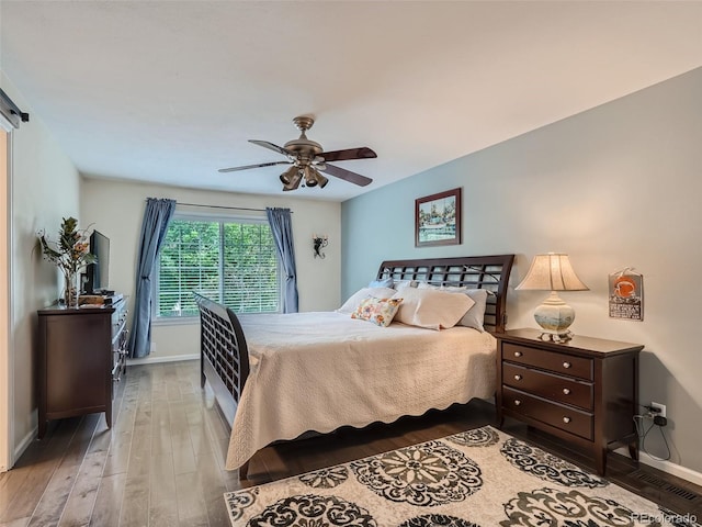 3265 W 11th Avenue Ct, Broomfield, CO 80020 - bedroom with wood finished floors, baseboards, and ceiling fan