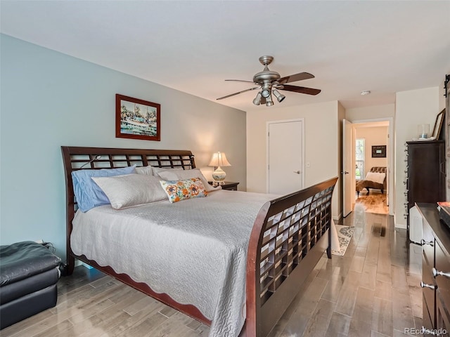 3265 W 11th Avenue Ct, Broomfield, CO 80020 - bedroom featuring wood finished floors and a ceiling fan