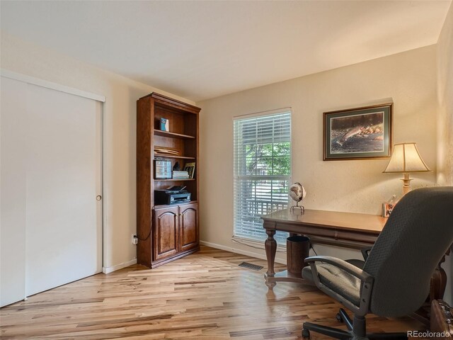 3265 W 11th Avenue Ct, Broomfield, CO 80020 - office space with light wood-style flooring and baseboards