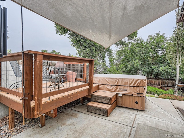 3265 W 11th Avenue Ct, Broomfield, CO 80020 - wooden deck with fence, a patio area, and a hot tub