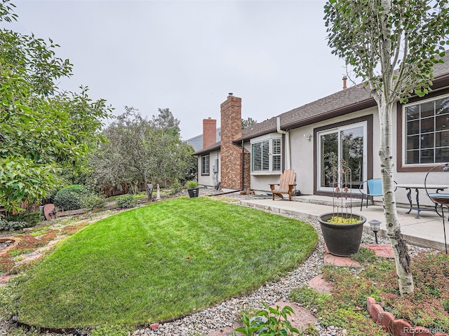 3265 W 11th Avenue Ct, Broomfield, CO 80020 - rear view of property with stucco siding, a patio area, a yard, and roof with shingles