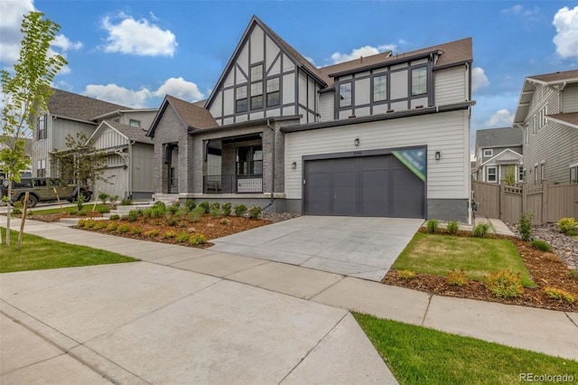 1846 Chestnut Ave, Erie, CO 80516 - view of front of property with driveway, an attached garage, and a porch