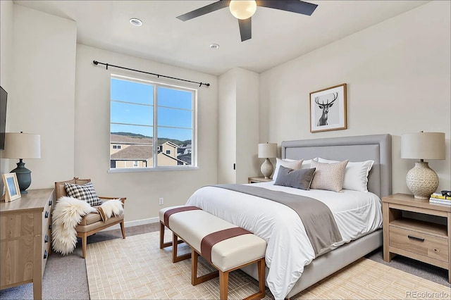 bedroom with baseboards and a ceiling fan