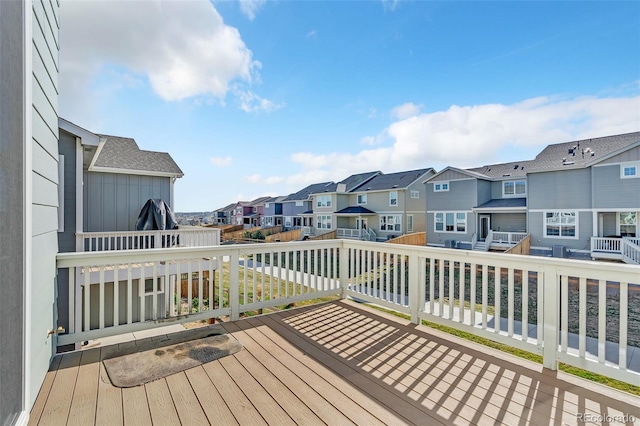 wooden deck featuring a residential view