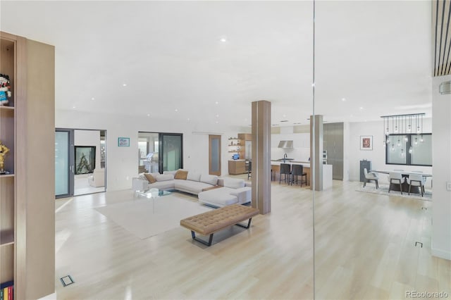living area featuring wood finished floors and recessed lighting