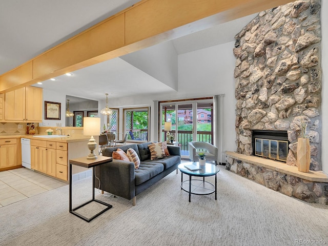 12658 W 1st Pl Unit 78, Denver, CO 80228 - living area featuring light carpet, a fireplace, and light tile patterned floors