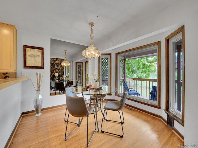12658 W 1st Pl Unit 78, Denver, CO 80228 - dining room with plenty of natural light, a chandelier, and light wood-type flooring